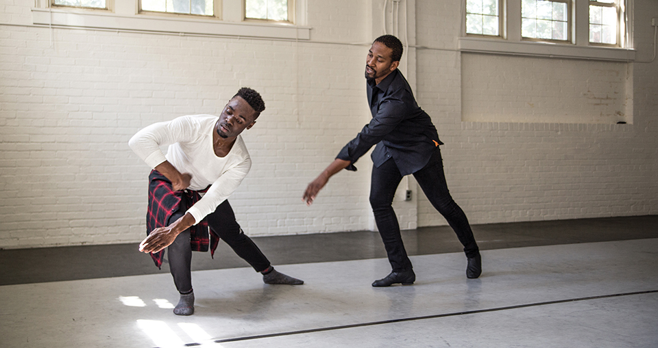 Duane Cyrus (right) works with recent UNCG BFA grad Devonte Wells [Photography by Mike Dickens]
