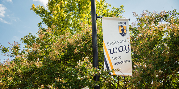 A "find your way here" sign on campus