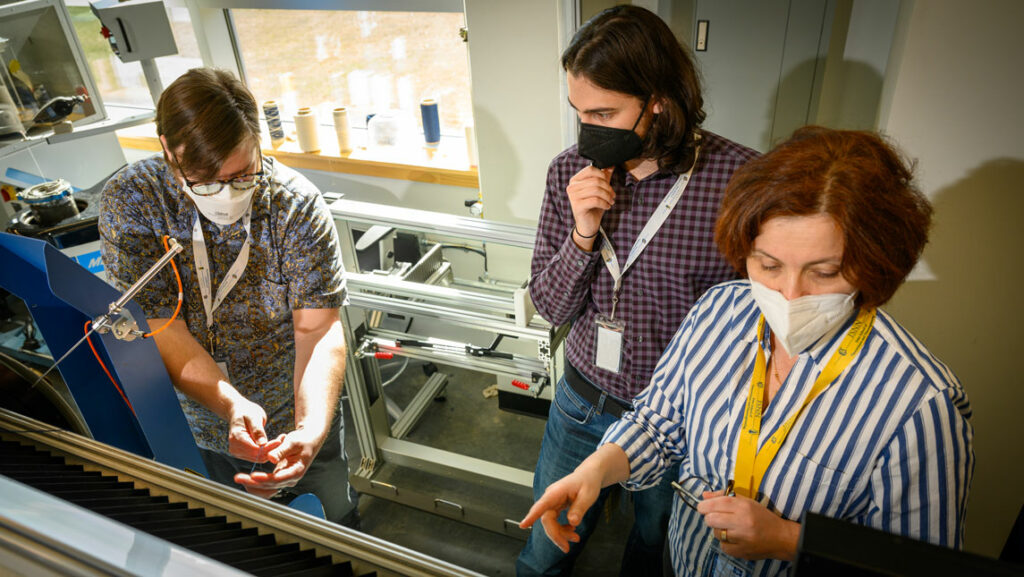 JSNN students Anthony Trofe and Jared Averitt with Dr. Tetyana Ignatova with donated textile equipment from Kontoor Brands
