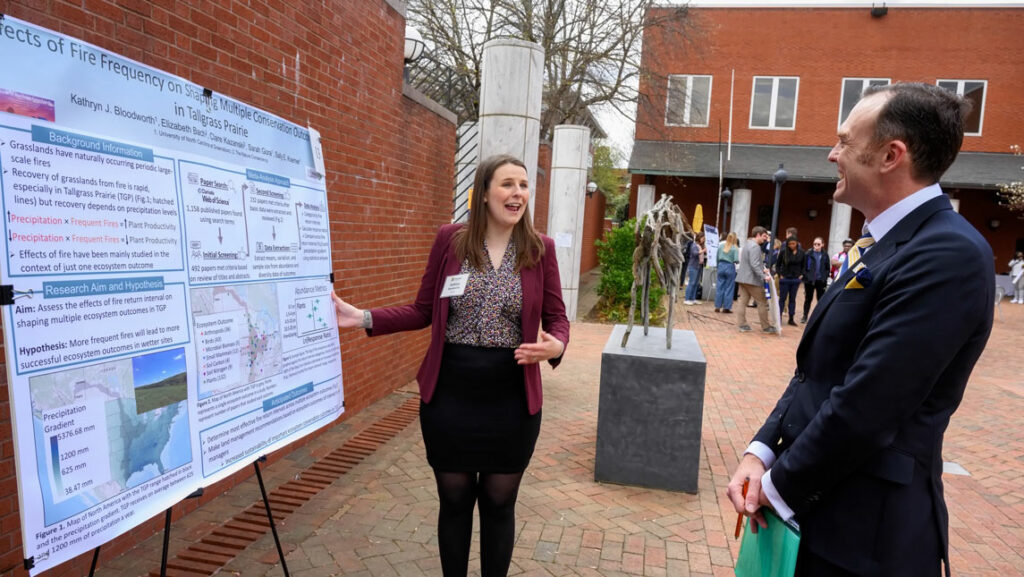 A graduate student presenting her research during the 2022 Graduate Research & Creativity Expo