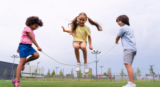 Three children playing jump-rope