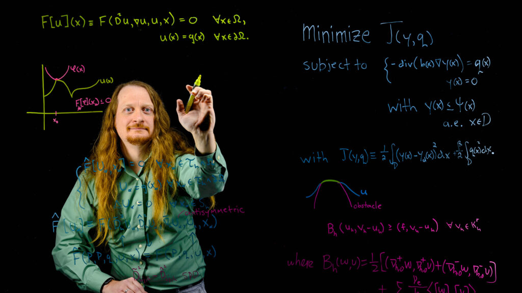 Mathematician writes equations on glass