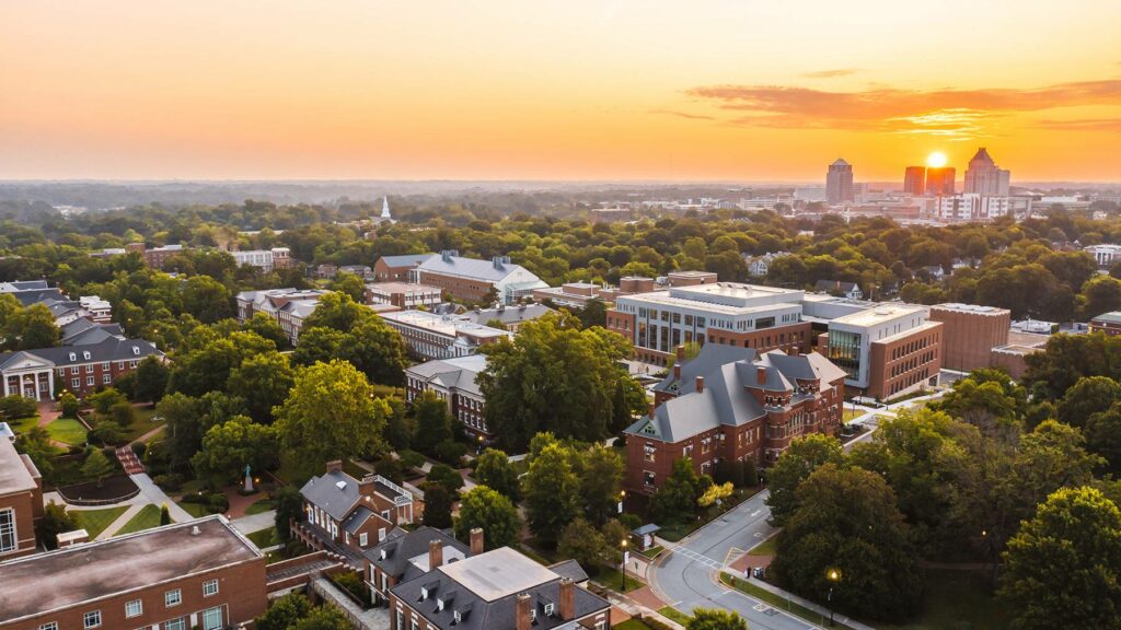 Aerial photo of UNCG campus at dusk