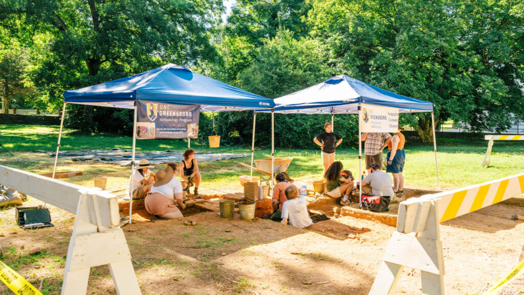 UNCG students excavate remains of an early pottery kilm at Old Salem