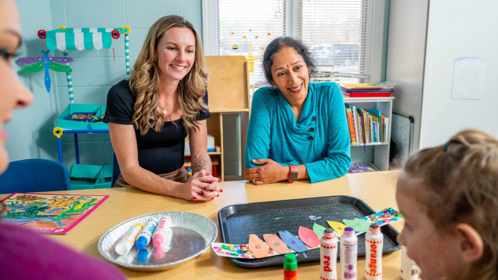 Bringing Out the Best staff working with a preschooler