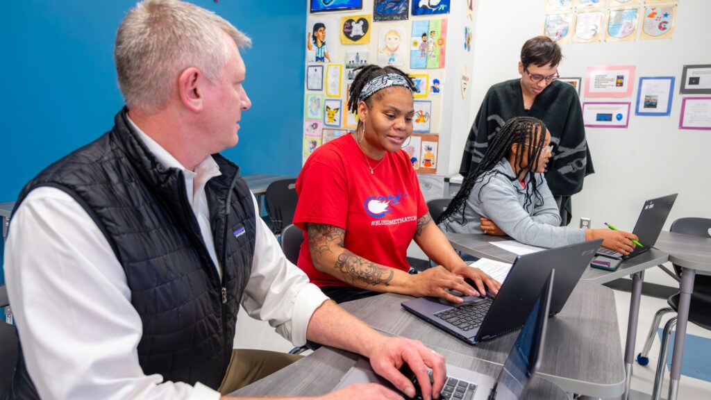 Teachers at computers working