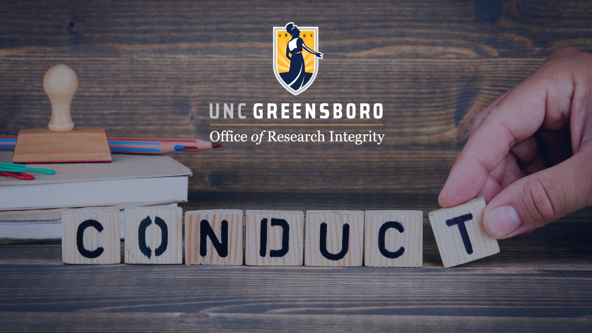 Blocks that spell conduct with UNCG's Office of Research Integrity's logo