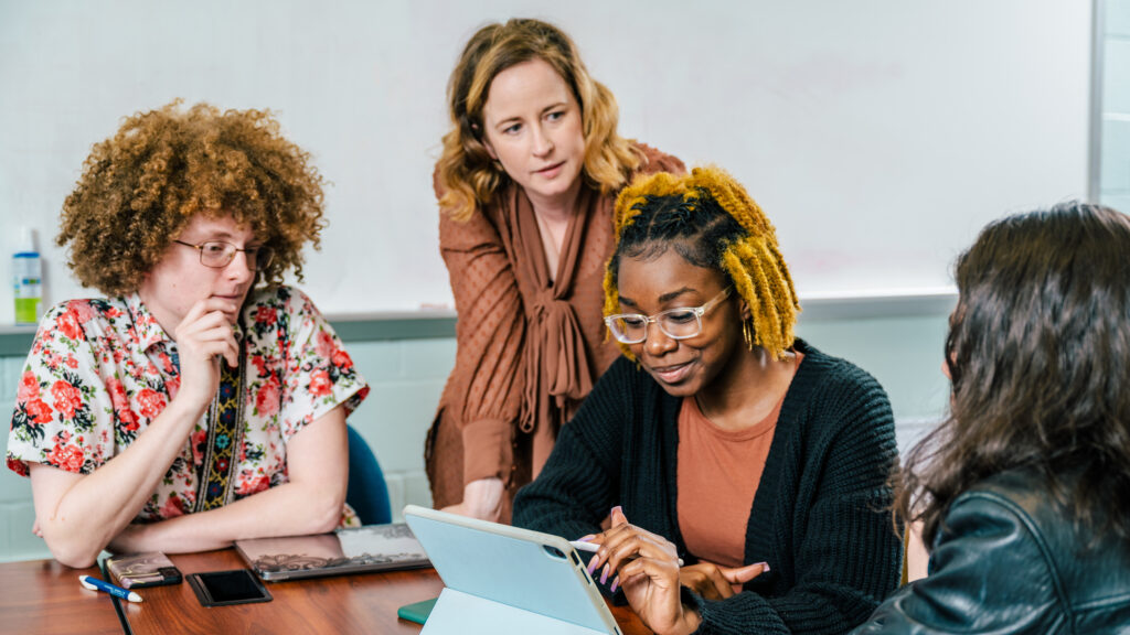 UNCG professor Michealine Jensen working with undergraduate researchers