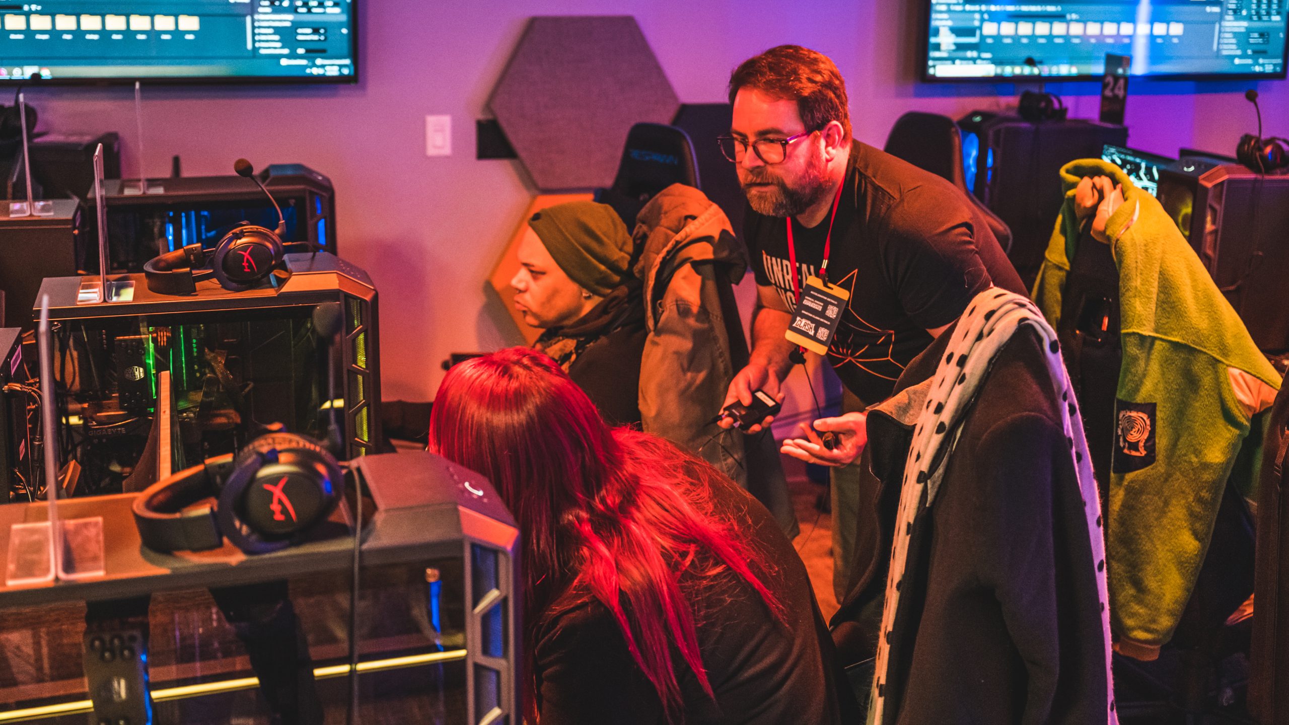 An Unreal Engine instructor works with an educator who came to UNCG eSports' E2 Weekend