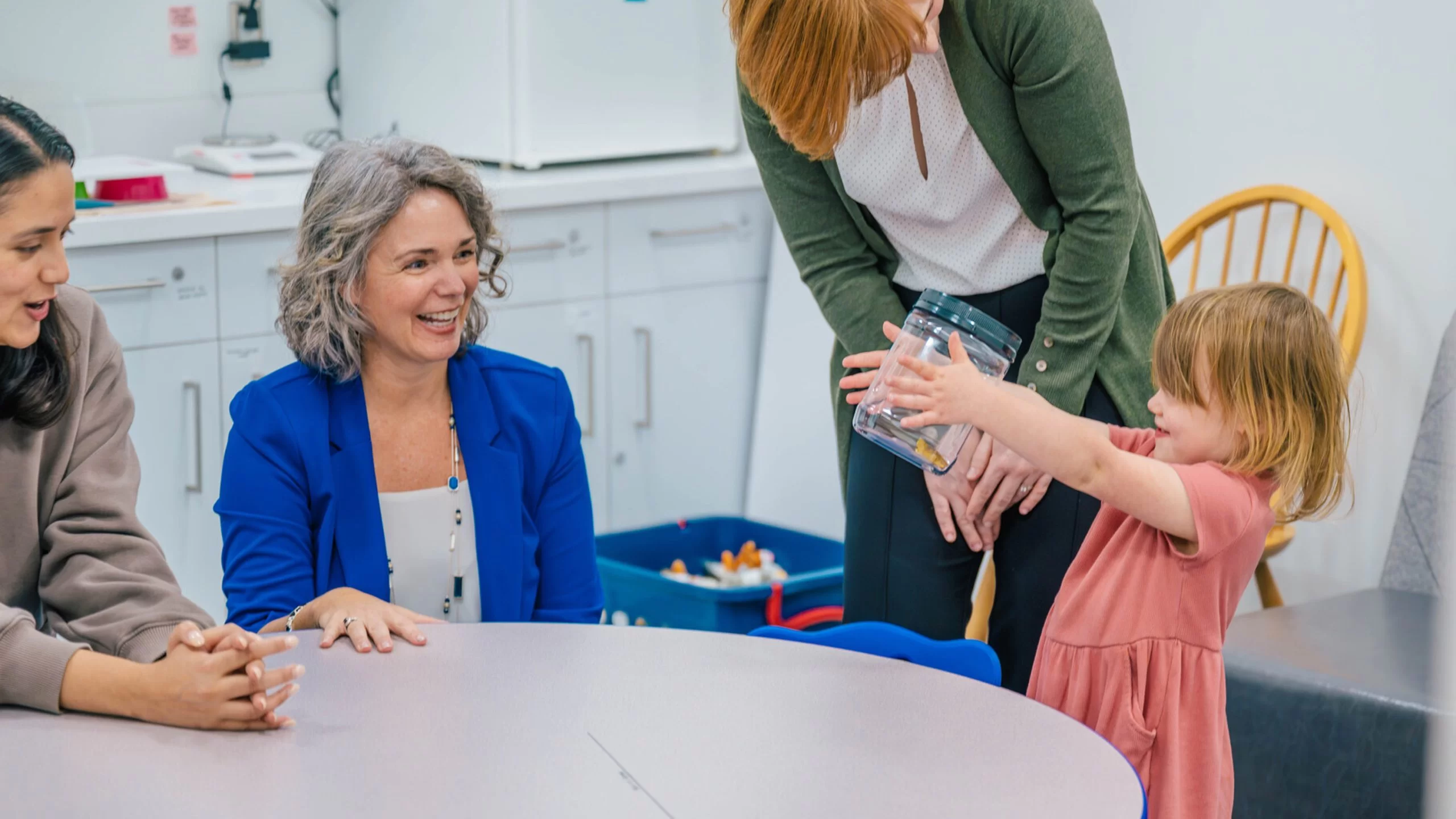 Esther Leerkes smiles at a toddler