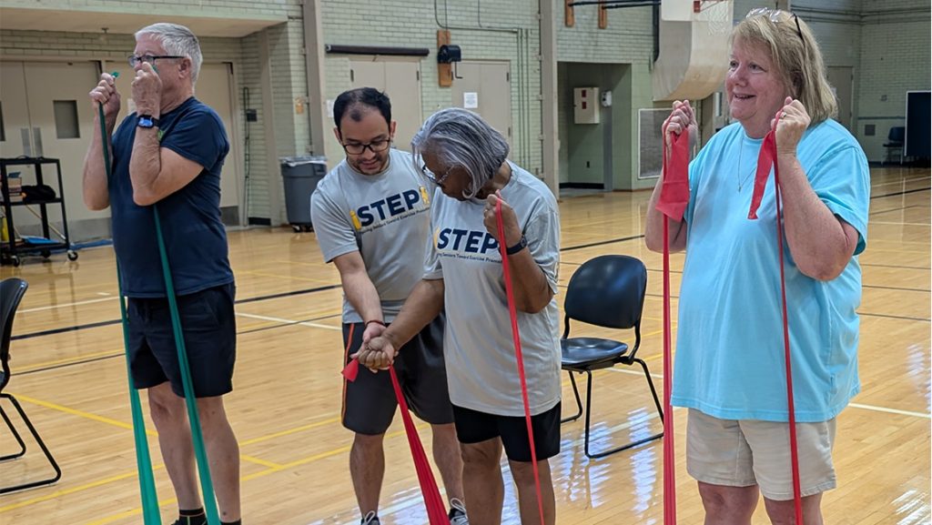 Older adults work with gerontology for an exercise class